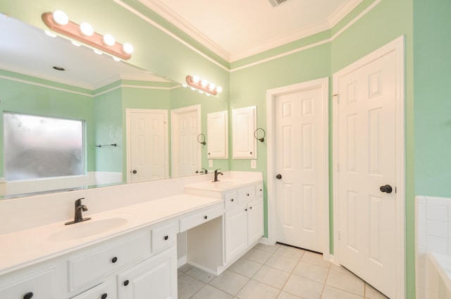 bathroom featuring a washtub, vanity, tile patterned floors, and crown molding