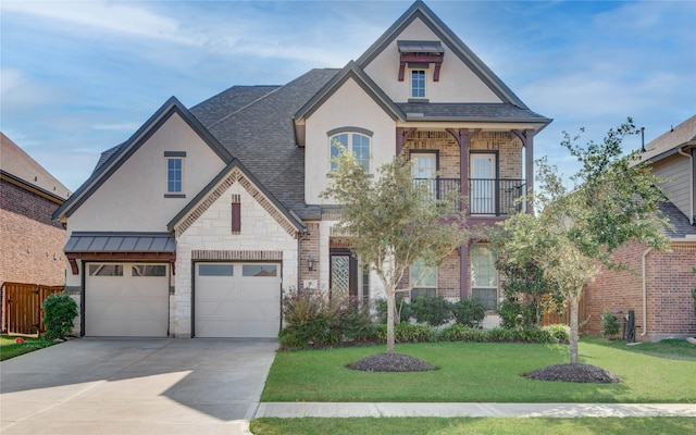 view of front of property with a garage and a front yard