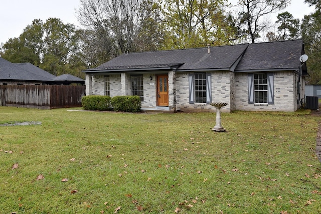 single story home featuring a front lawn and cooling unit