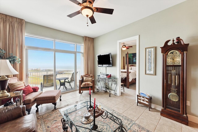 tiled living room featuring ceiling fan