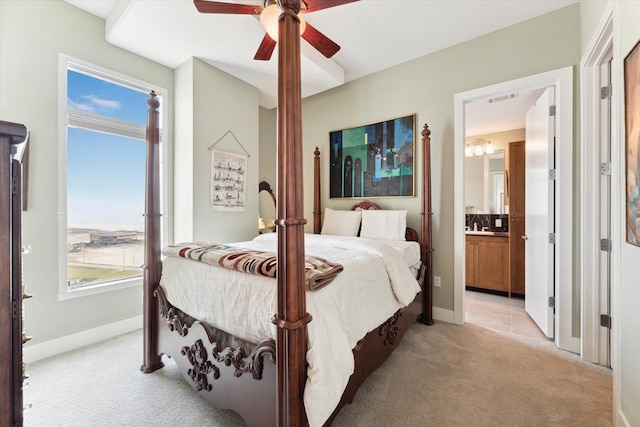 carpeted bedroom featuring ensuite bathroom and ceiling fan