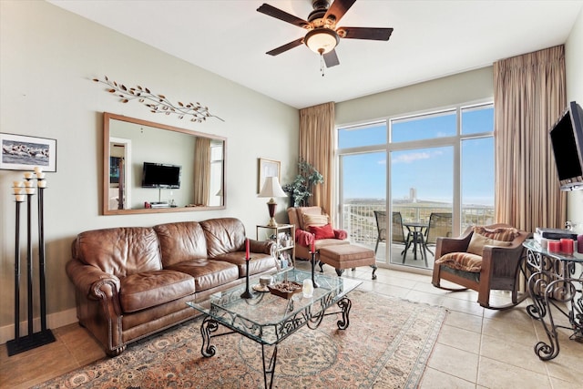 living room featuring ceiling fan and light tile patterned floors