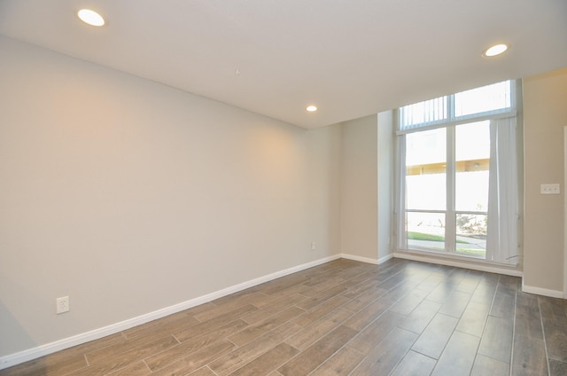 spare room featuring hardwood / wood-style floors