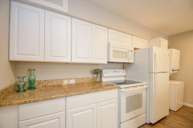 kitchen featuring white cabinetry, white appliances, and light wood-type flooring