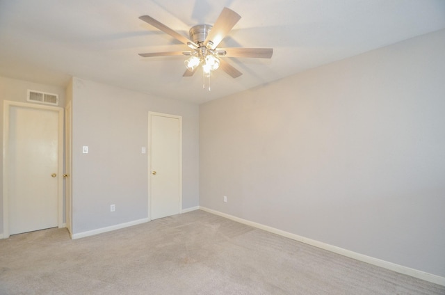 carpeted empty room with ceiling fan