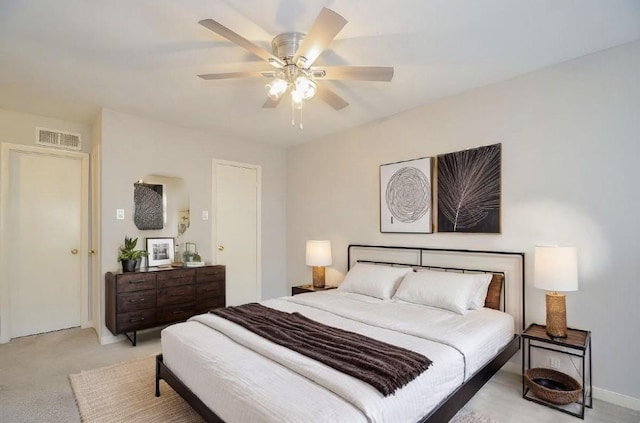 bedroom featuring ceiling fan and light colored carpet