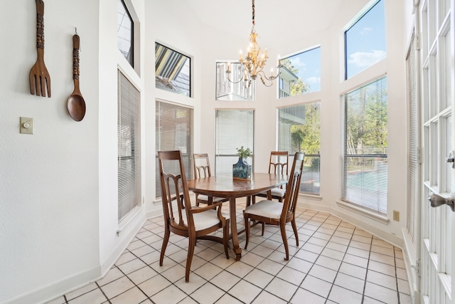 sunroom / solarium with a notable chandelier