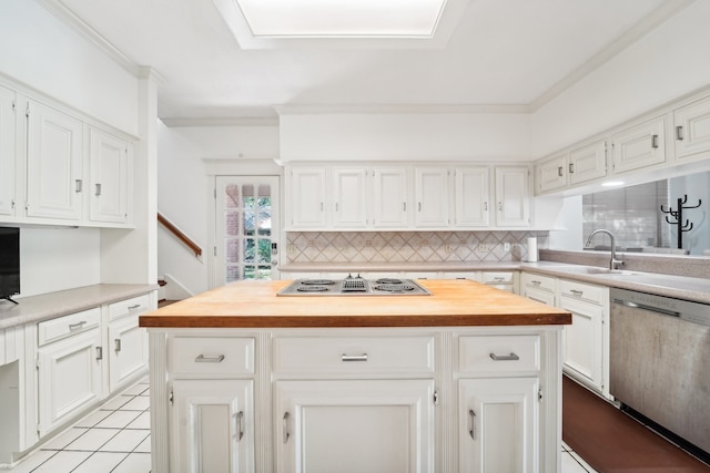 kitchen with white electric cooktop, white cabinetry, dishwasher, and a center island