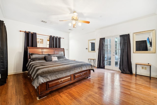 bedroom featuring hardwood / wood-style flooring, ceiling fan, access to exterior, and french doors