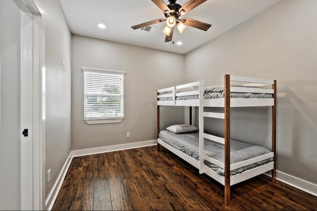 bedroom with ceiling fan and dark wood-type flooring