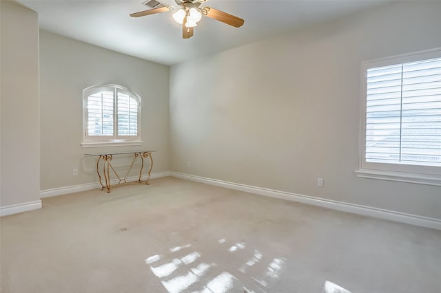 carpeted empty room with ceiling fan