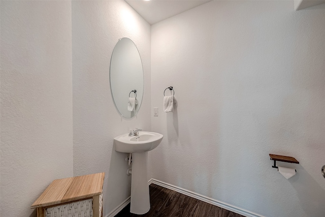 bathroom with sink and hardwood / wood-style flooring