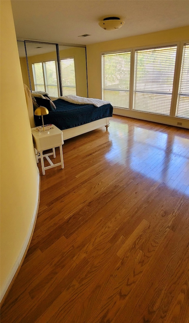 bedroom with hardwood / wood-style flooring