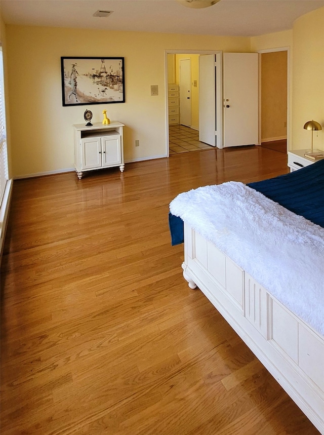 bedroom with light hardwood / wood-style flooring