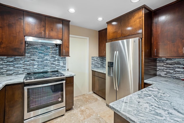 kitchen featuring backsplash, light stone countertops, and stainless steel appliances