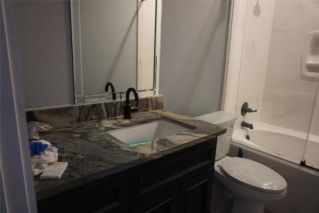 full bathroom with vanity, toilet, and washtub / shower combination