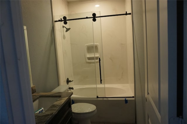 full bathroom with vanity, toilet, and enclosed tub / shower combo