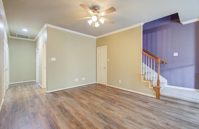 spare room featuring ceiling fan, crown molding, and hardwood / wood-style flooring