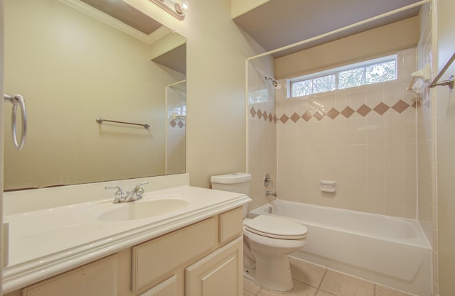 full bathroom featuring tile patterned floors, vanity, crown molding, toilet, and tiled shower / bath