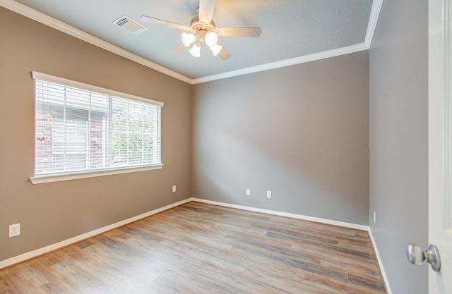 empty room with light hardwood / wood-style flooring, ceiling fan, and ornamental molding