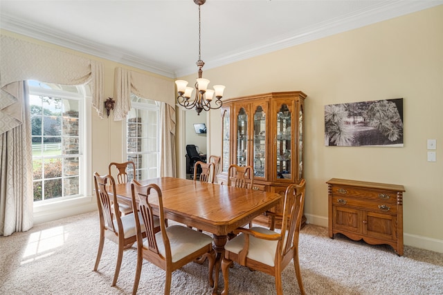 dining area with a notable chandelier, light colored carpet, and crown molding