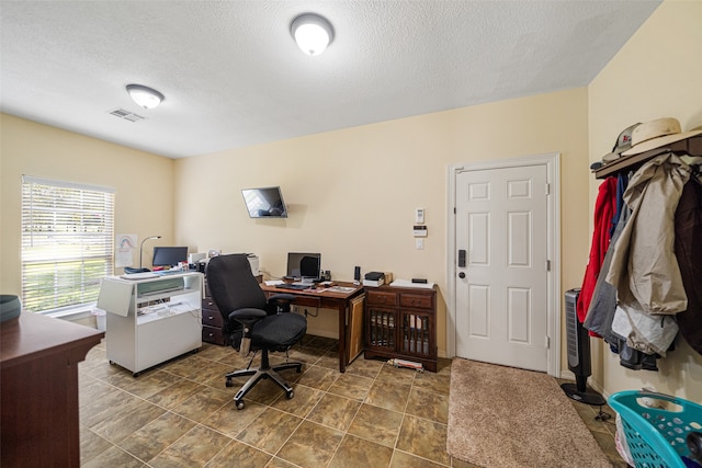 office area featuring a textured ceiling