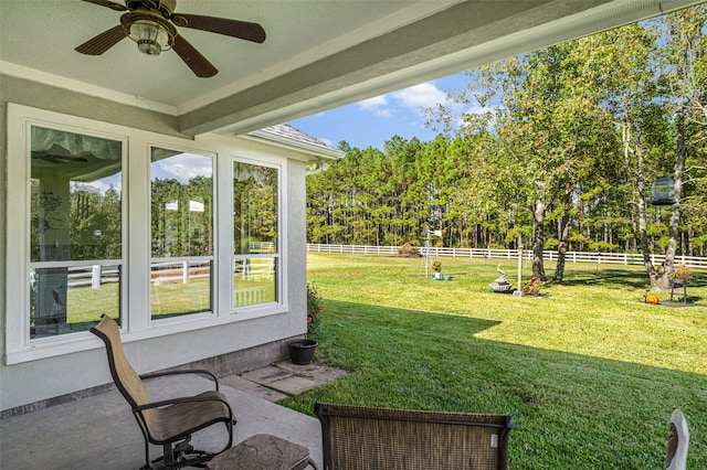 view of yard featuring ceiling fan