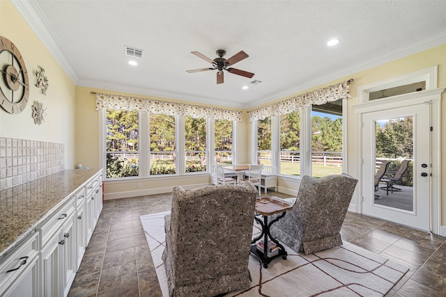 sunroom / solarium with ceiling fan