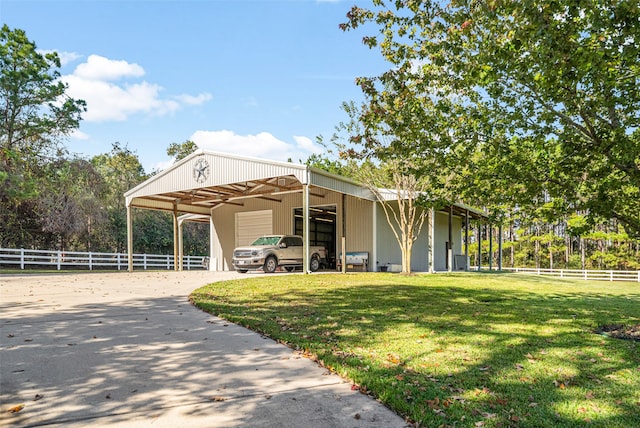 view of front of property with an outbuilding and a front yard