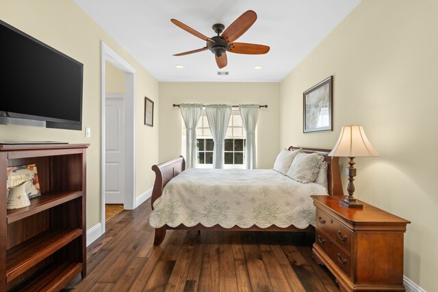 bedroom featuring ceiling fan and dark wood-type flooring