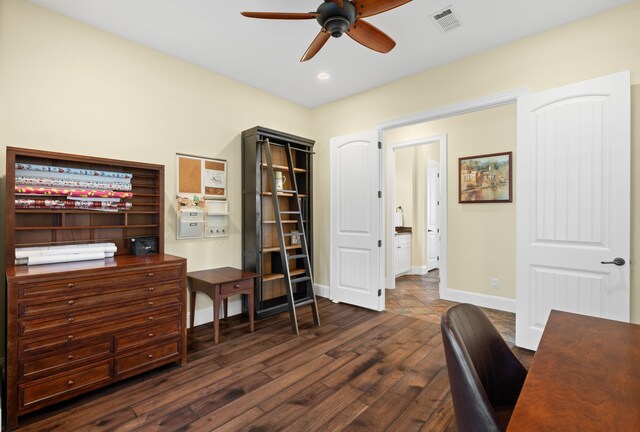 home office featuring dark hardwood / wood-style floors and ceiling fan