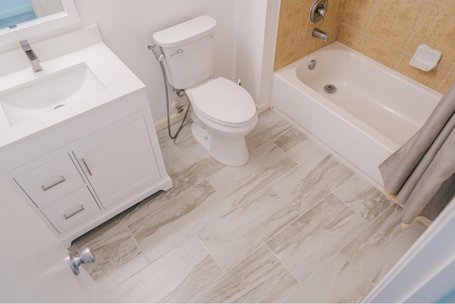 full bathroom with vanity, shower / tub combo, and toilet