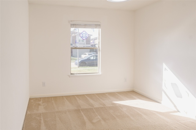 carpeted empty room with plenty of natural light