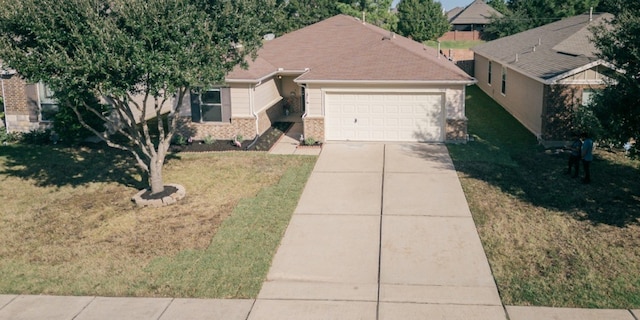 ranch-style home with a garage and a front yard