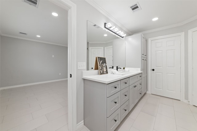 bathroom with tile patterned floors, vanity, and ornamental molding