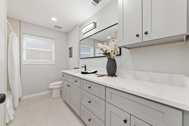 bathroom with tile patterned flooring, vanity, toilet, and a shower with curtain