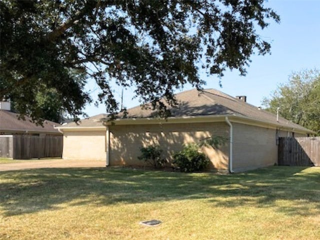 view of property exterior featuring a yard