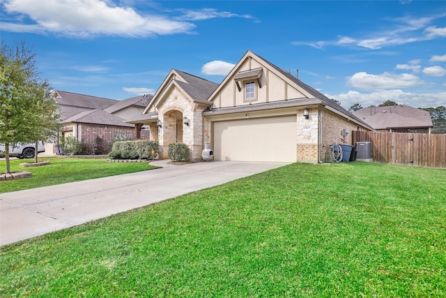 view of front of property with central AC unit, a garage, and a front lawn