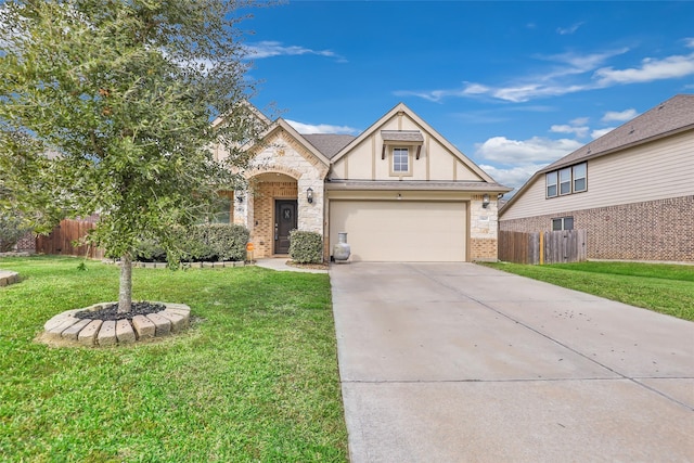 view of front of property featuring a garage and a front yard