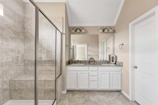 bathroom with vanity, a shower with door, and ornamental molding