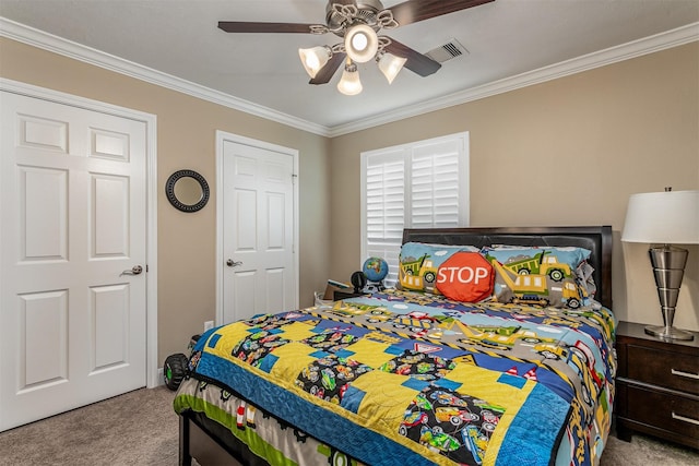 carpeted bedroom with ceiling fan and ornamental molding