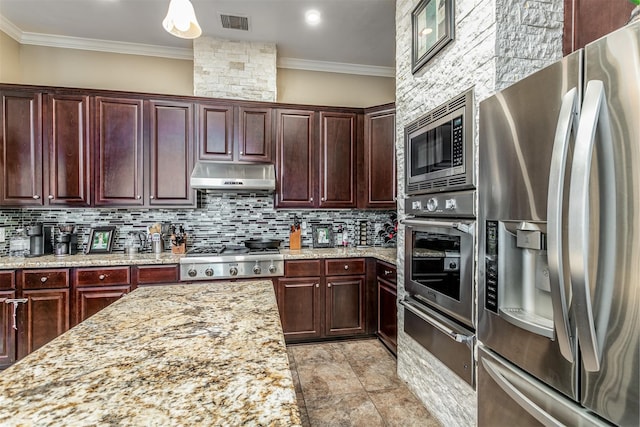 kitchen with appliances with stainless steel finishes, backsplash, light stone counters, and crown molding