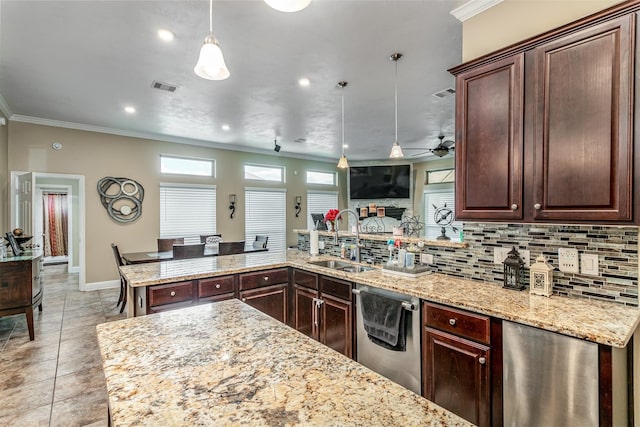 kitchen featuring pendant lighting, dishwasher, sink, ornamental molding, and tasteful backsplash