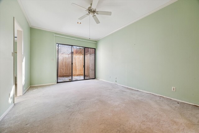 unfurnished room featuring ceiling fan, crown molding, and light carpet