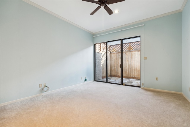 empty room featuring ceiling fan, carpet floors, and ornamental molding