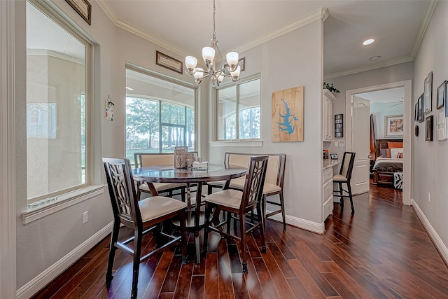 dining area featuring ceiling fan with notable chandelier, dark hardwood / wood-style floors, and ornamental molding