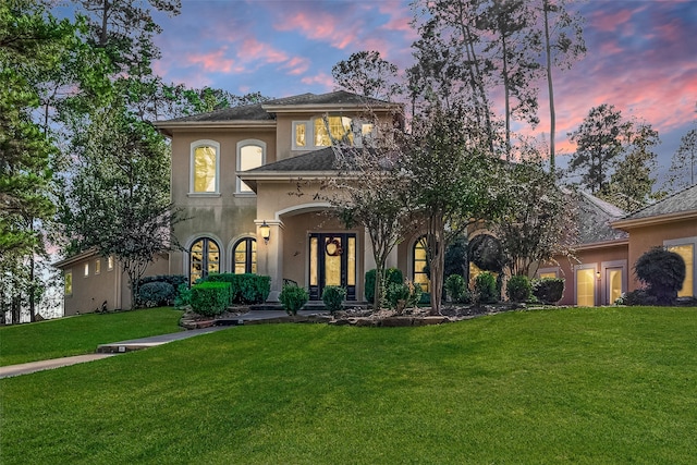 view of front of property with a lawn