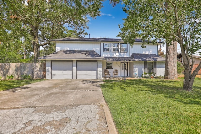 view of front of house with a front lawn and a garage