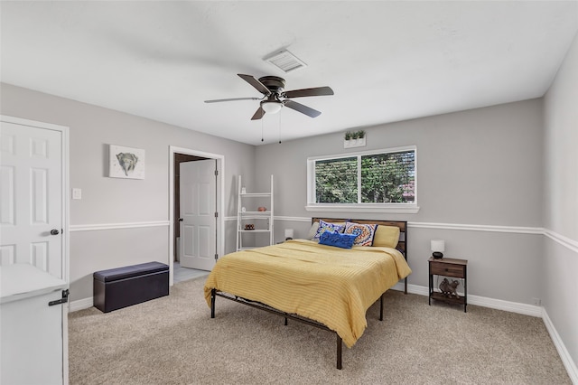 bedroom with ceiling fan and light colored carpet