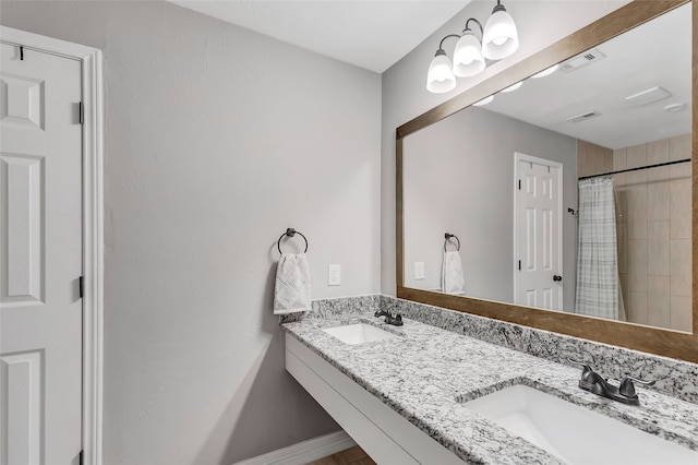 bathroom with vanity and walk in shower